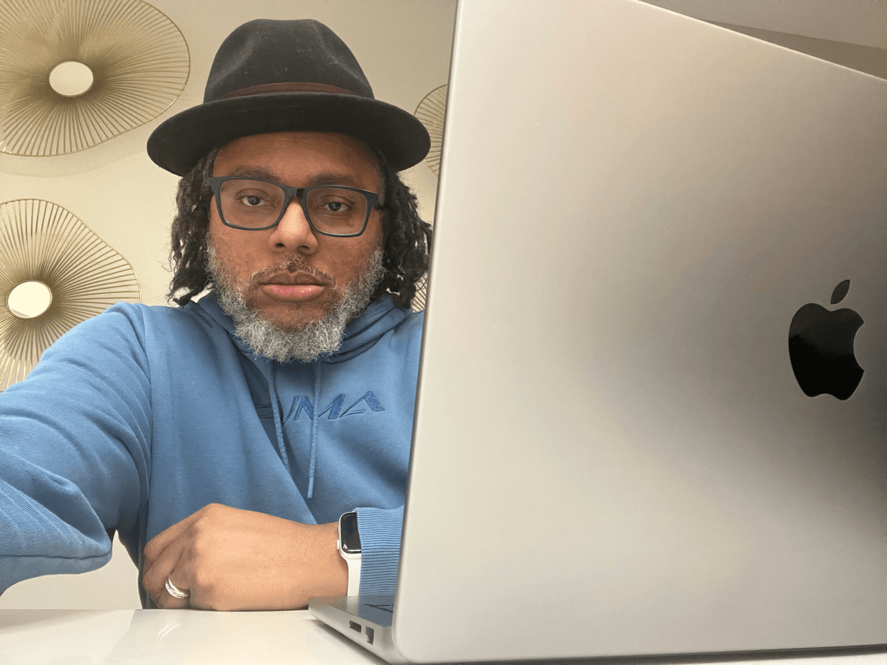 B Donald Harris, founder and technologist, working at his laptop.